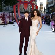 Check out Tom Holland's scene-stealing burgundy suit and Spider Brooch!