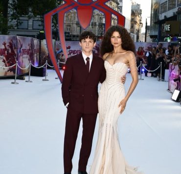 Check out Tom Holland's scene-stealing burgundy suit and Spider Brooch!